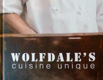 Wolfdales name on wood with chef in background