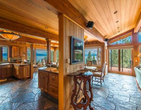 dining room looking out large windows toward lake