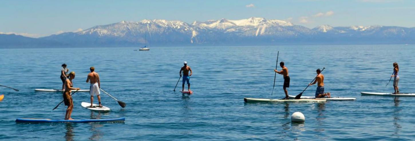 people on stand up paddle boards in tahoe